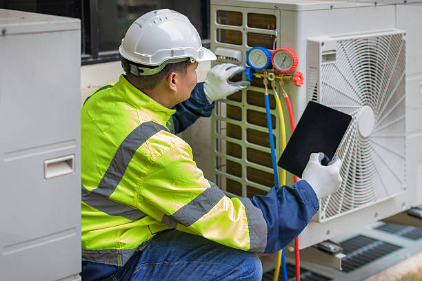 Professional Air Duct Cleaning technician working in Englewood, CO